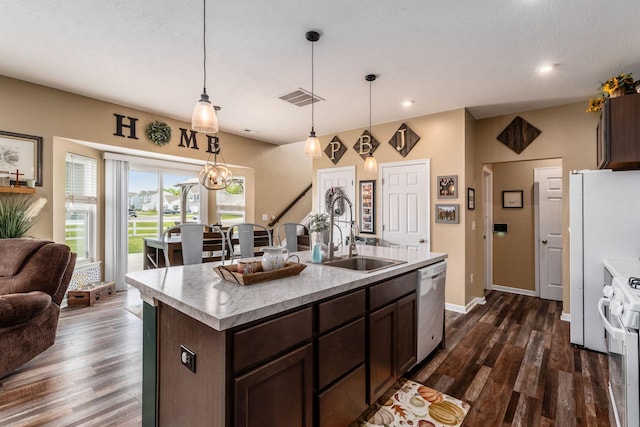 5070 River Bend Dr, South Bloomfield, OH 43103 - kitchen featuring stainless steel dishwasher, white range with gas stovetop, light countertops, dark wood finished floors, and dark brown cabinetry