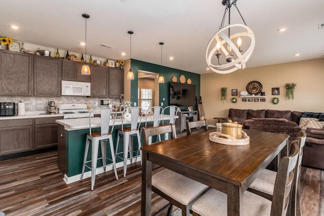 5070 River Bend Dr, South Bloomfield, OH 43103 - dining space with dark wood-style flooring, recessed lighting, and a chandelier