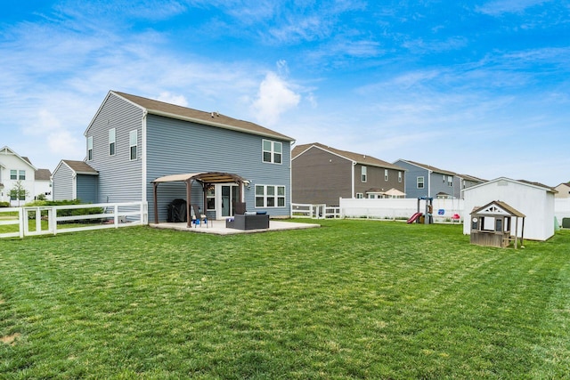 5070 River Bend Dr, South Bloomfield, OH 43103 - back of property featuring a playground, a patio area, an outdoor hangout area, a fenced backyard, and a residential view