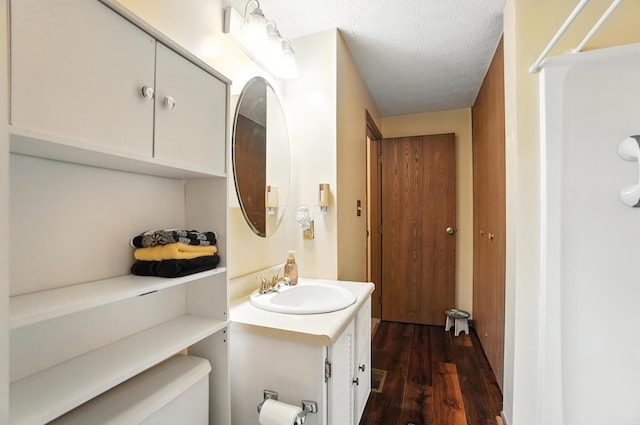 7207 Bride Water Blvd, Columbus, OH 43235 - full bathroom with vanity, wood finished floors, a textured ceiling, and a shower