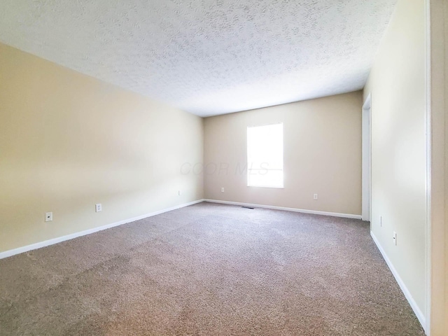 6149 Georges Park Dr Unit 9E, Canal Winchester, OH 43110 - carpeted spare room with a textured ceiling and baseboards
