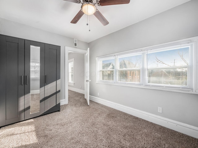 126 E 6th Ave Unit 126, Columbus, OH 43201 - unfurnished bedroom with light colored carpet and a ceiling fan