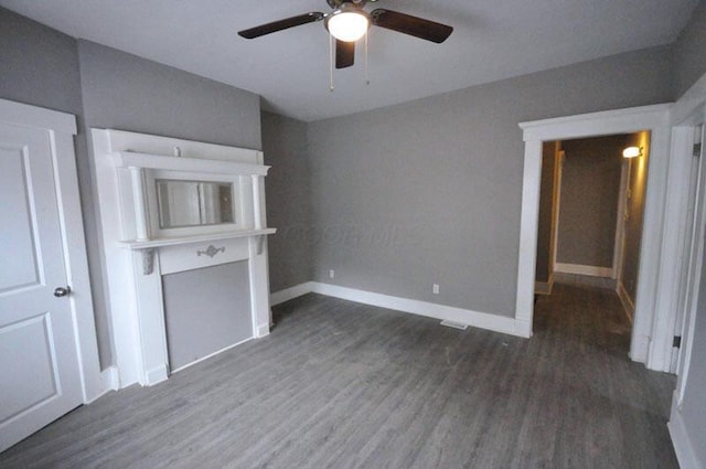 126 E 6th Ave Unit 126, Columbus, OH 43201 - unfurnished living room featuring ceiling fan and wood finished floors