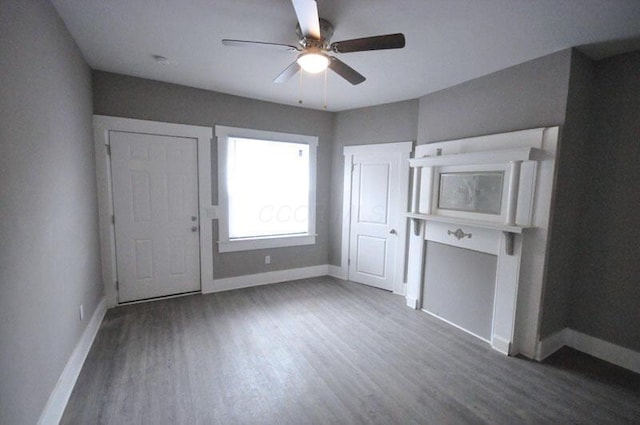 126 E 6th Ave Unit 126, Columbus, OH 43201 - unfurnished living room featuring a ceiling fan and wood finished floors