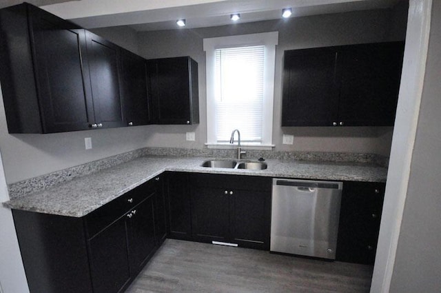 126 E 6th Ave Unit 126, Columbus, OH 43201 - kitchen with stainless steel dishwasher, dark cabinets, and light wood-style flooring