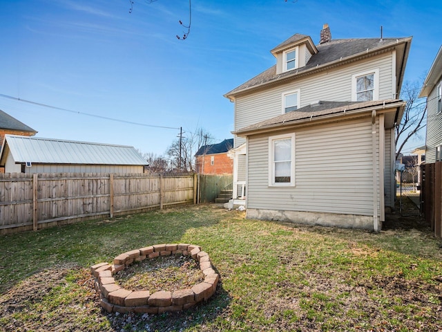 126 E 6th Ave Unit 126, Columbus, OH 43201 - rear view of house featuring a fenced backyard and entry steps