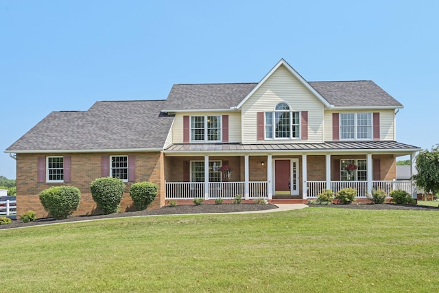 6281 Davis Dr, Newark, OH 43056 - colonial inspired home featuring brick siding, a standing seam roof, covered porch, and roof with shingles