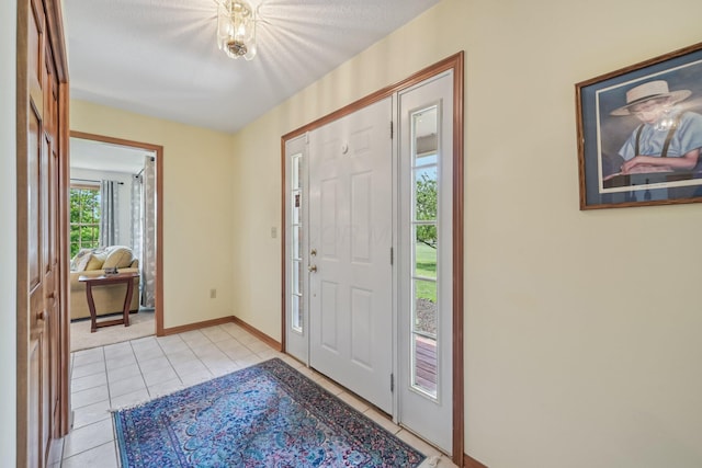 6281 Davis Dr, Newark, OH 43056 - entryway with light tile patterned floors and baseboards