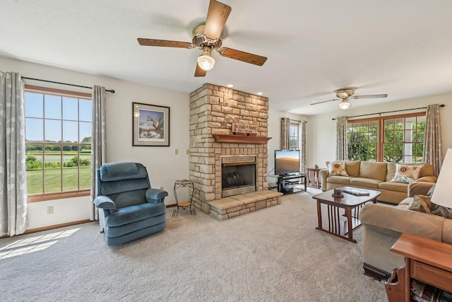 6281 Davis Dr, Newark, OH 43056 - living room with ceiling fan, carpet floors, and a stone fireplace