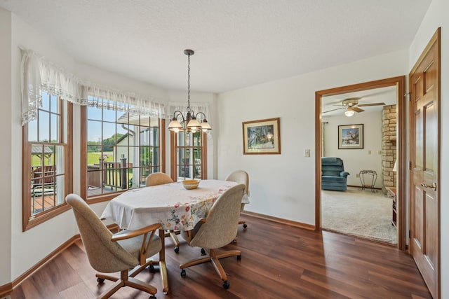 6281 Davis Dr, Newark, OH 43056 - dining room with dark wood-style floors, a textured ceiling, and a chandelier