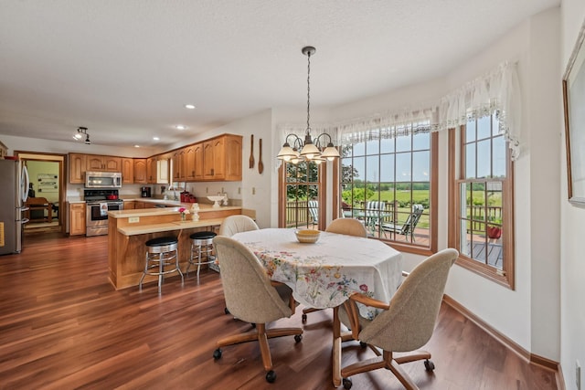 6281 Davis Dr, Newark, OH 43056 - dining area featuring a chandelier, dark wood finished floors, and recessed lighting