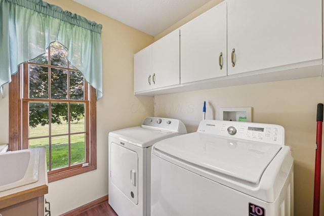 6281 Davis Dr, Newark, OH 43056 - laundry room featuring washing machine and clothes dryer, cabinet space, and dark wood finished floors