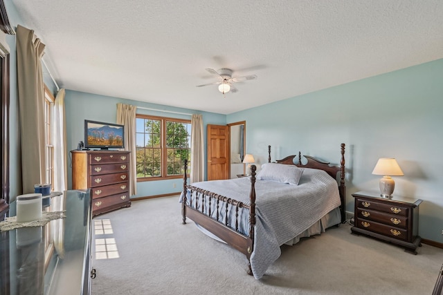 6281 Davis Dr, Newark, OH 43056 - bedroom with light carpet, a textured ceiling, and a ceiling fan