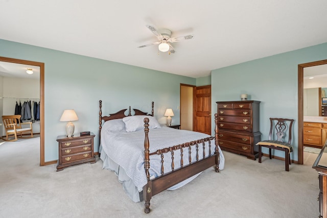 6281 Davis Dr, Newark, OH 43056 - bedroom featuring light colored carpet, a closet, a walk in closet, and ceiling fan
