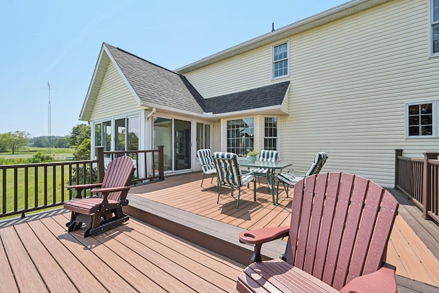 6281 Davis Dr, Newark, OH 43056 - wooden deck featuring outdoor dining space, a sunroom, and a yard