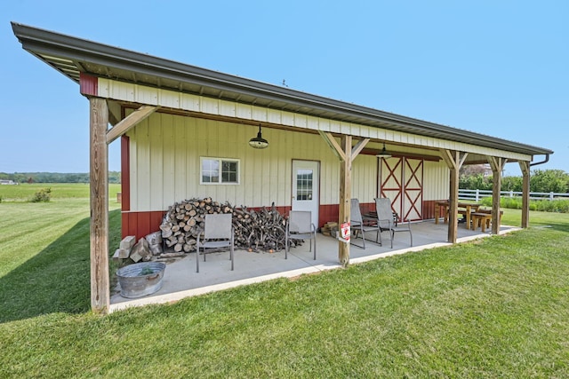 6281 Davis Dr, Newark, OH 43056 - rear view of house featuring a patio and a lawn