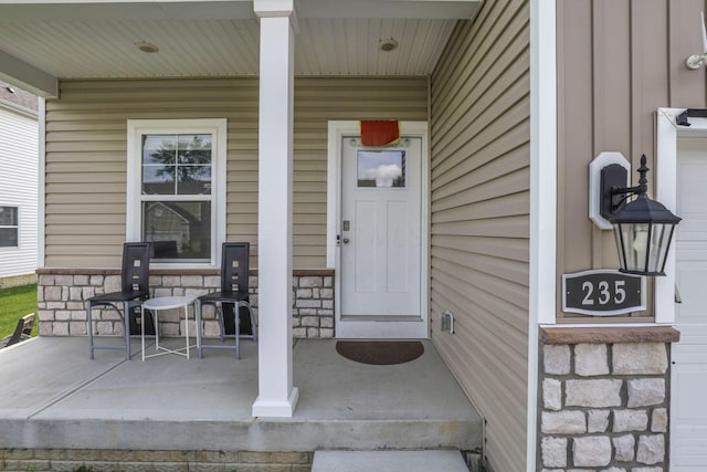 235 Old Bay Dr, Pataskala, OH 43062 - view of exterior entry with a porch and stone siding
