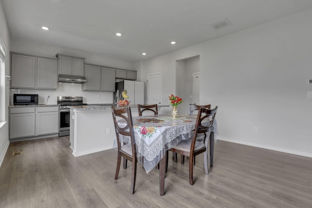235 Old Bay Dr, Pataskala, OH 43062 - dining space featuring wood finished floors and recessed lighting