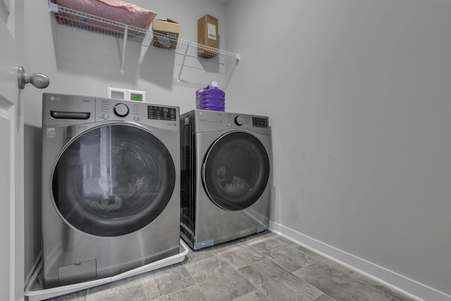 235 Old Bay Dr, Pataskala, OH 43062 - washroom with washer and dryer and stone finish floors