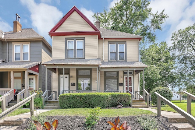 611 E 11th Ave, Columbus, OH 43211 - view of front of home featuring a porch and a chimney