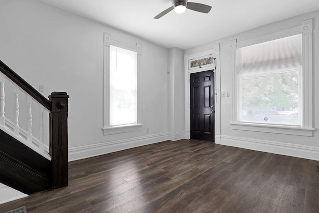 611 E 11th Ave, Columbus, OH 43211 - foyer with wood finished floors, a ceiling fan, and stairs