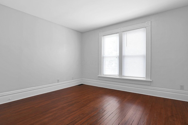 611 E 11th Ave, Columbus, OH 43211 - spare room featuring dark wood finished floors and baseboards