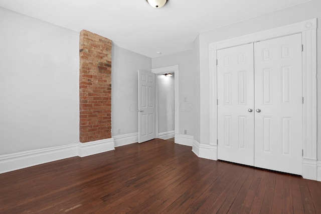 611 E 11th Ave, Columbus, OH 43211 - unfurnished bedroom featuring hardwood / wood-style flooring and a closet