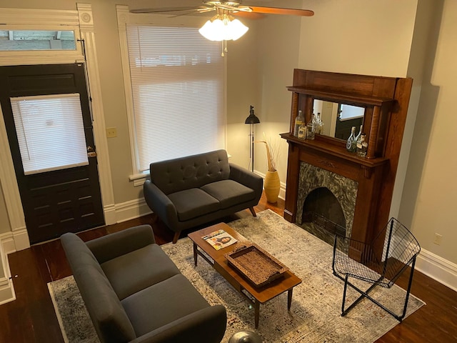 617 E 11th Ave, Columbus, OH 43211 - living area with wood finished floors, ceiling fan, and a fireplace