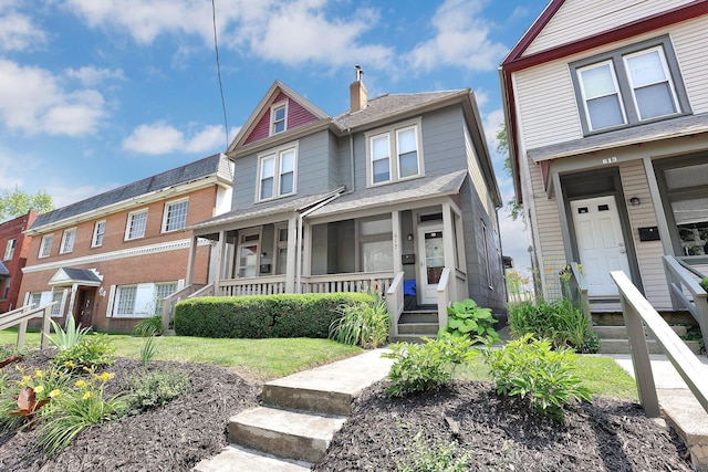 617 E 11th Ave, Columbus, OH 43211 - view of front of house with a porch and a chimney