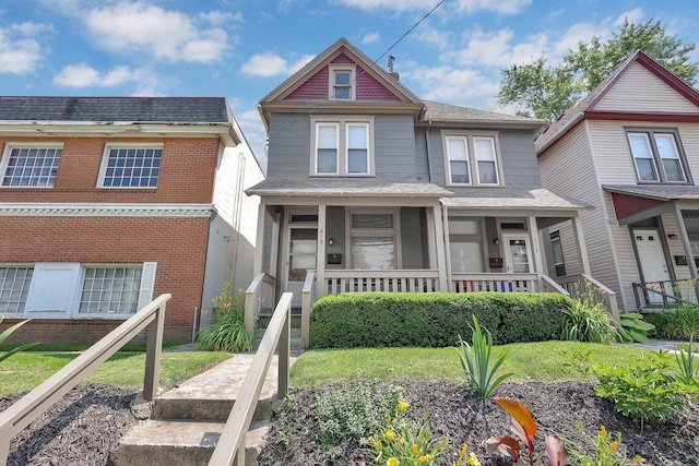 617 E 11th Ave, Columbus, OH 43211 - view of front of house with covered porch and brick siding