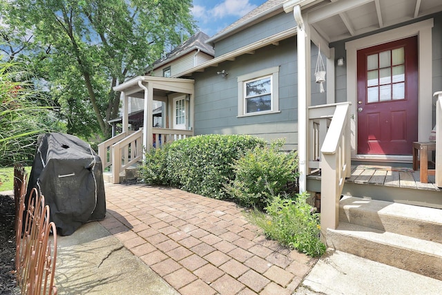 617 E 11th Ave, Columbus, OH 43211 - property entrance with a patio and a shingled roof