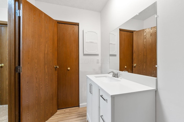 5198 Dierker Rd Unit D, Columbus, OH 43220 - bathroom featuring vanity and wood finished floors