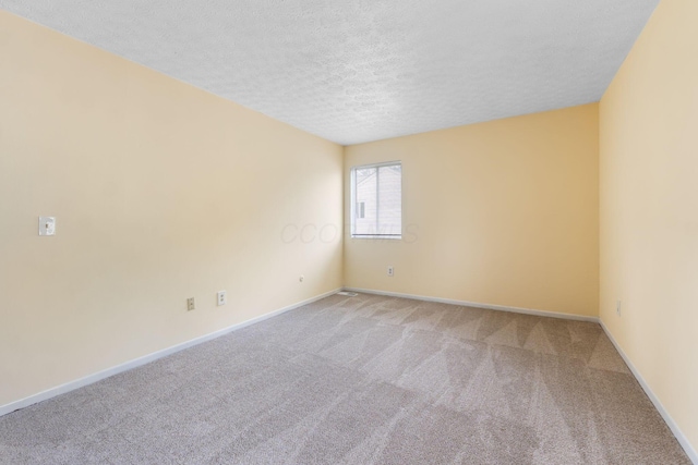 5198 Dierker Rd Unit D, Columbus, OH 43220 - spare room with light carpet and a textured ceiling
