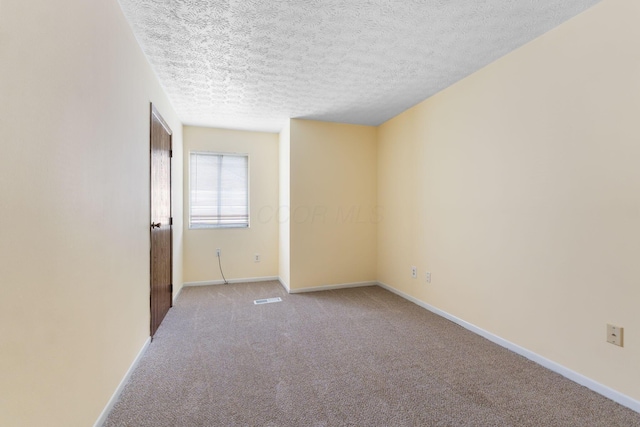 5198 Dierker Rd Unit D, Columbus, OH 43220 - spare room featuring carpet flooring and a textured ceiling