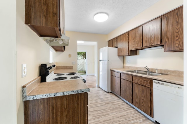 5198 Dierker Rd Unit D, Columbus, OH 43220 - kitchen featuring white appliances, light wood-style floors, light countertops, and a textured ceiling