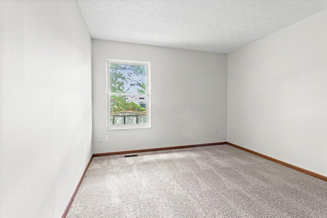 1280 Kariba Dr, Columbus, OH 43207 - spare room with carpet flooring and a textured ceiling