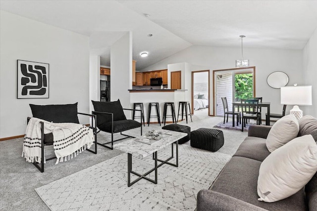 1280 Kariba Dr, Columbus, OH 43207 - living area featuring light carpet and vaulted ceiling