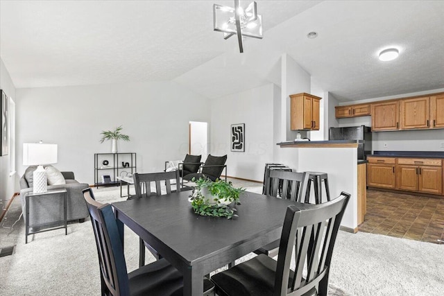 1280 Kariba Dr, Columbus, OH 43207 - carpeted dining space featuring vaulted ceiling and a chandelier