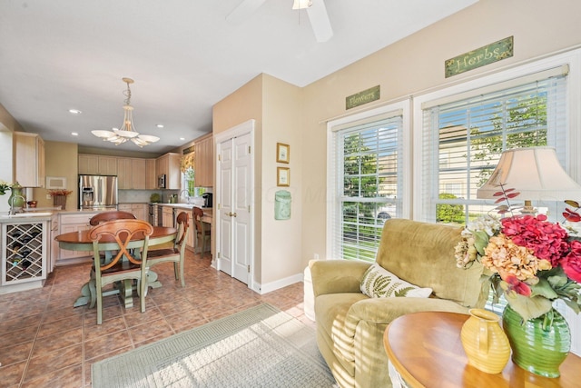 6150 Heritage Lakes Dr, Hilliard, OH 43026 - tiled dining room featuring a chandelier, recessed lighting, and ceiling fan