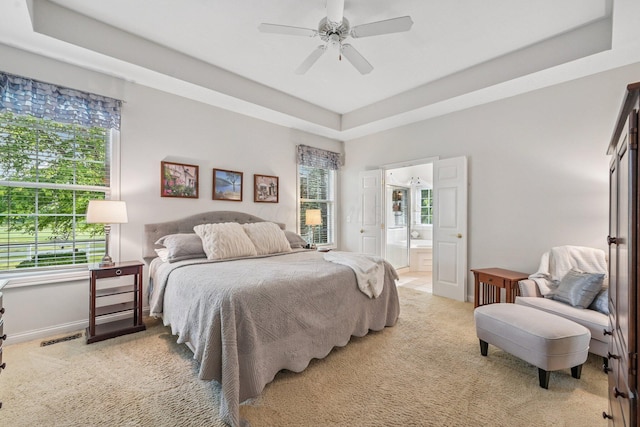 6150 Heritage Lakes Dr, Hilliard, OH 43026 - bedroom featuring carpet, multiple windows, a tray ceiling, and ceiling fan