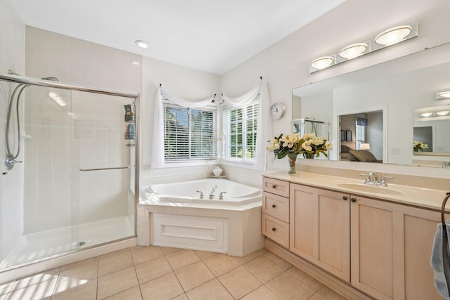 6150 Heritage Lakes Dr, Hilliard, OH 43026 - ensuite bathroom with a garden tub, vanity, a stall shower, and tile patterned flooring