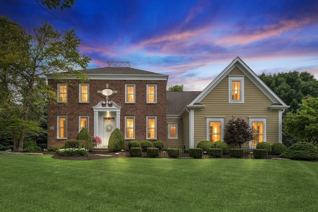 6150 Heritage Lakes Dr, Hilliard, OH 43026 - colonial house featuring a yard and brick siding