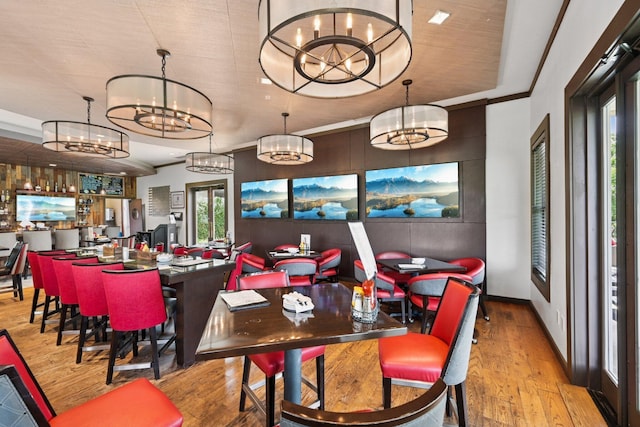 6150 Heritage Lakes Dr, Hilliard, OH 43026 - dining space featuring a chandelier and wood finished floors