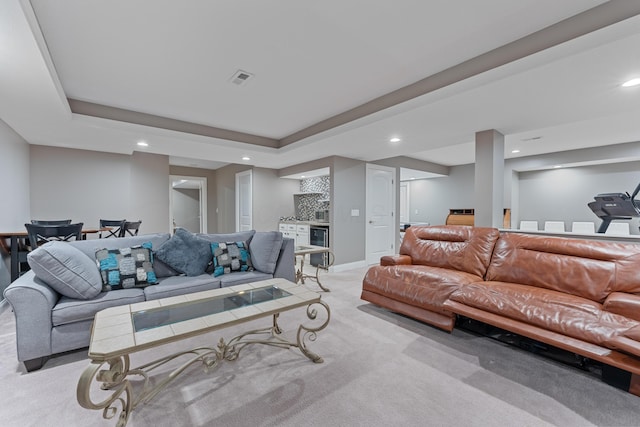 6037 Baronscourt Way, Dublin, OH 43016 - living room with light colored carpet, recessed lighting, bar, beverage cooler, and a raised ceiling