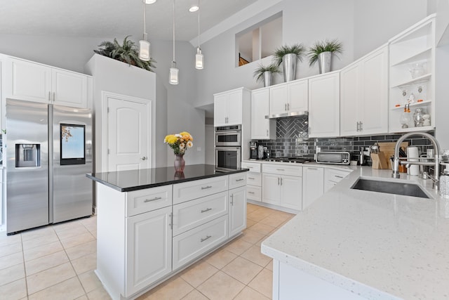 6037 Baronscourt Way, Dublin, OH 43016 - kitchen with stainless steel appliances, high vaulted ceiling, light tile patterned flooring, tasteful backsplash, and open shelves