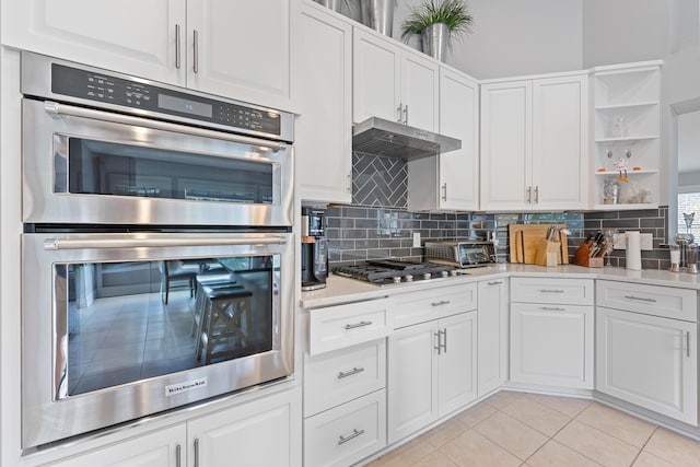 6037 Baronscourt Way, Dublin, OH 43016 - kitchen with appliances with stainless steel finishes, open shelves, white cabinetry, and light countertops