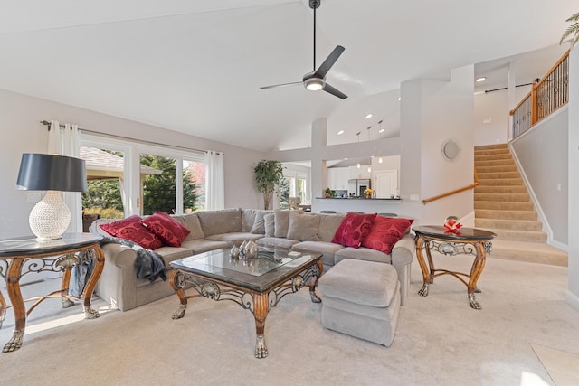 6037 Baronscourt Way, Dublin, OH 43016 - living room featuring ceiling fan, stairs, high vaulted ceiling, light carpet, and recessed lighting