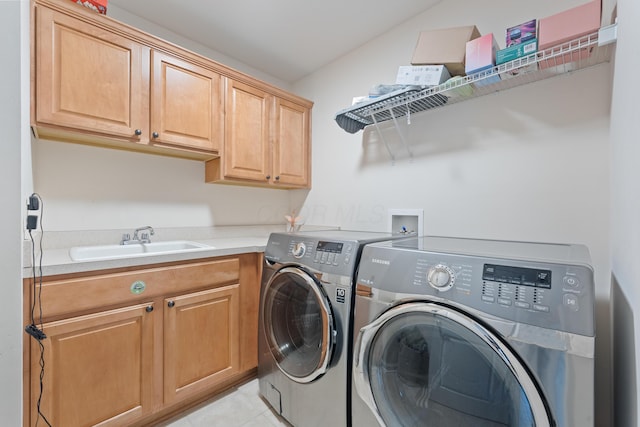 6037 Baronscourt Way, Dublin, OH 43016 - washroom with washer and dryer, cabinet space, and light tile patterned floors