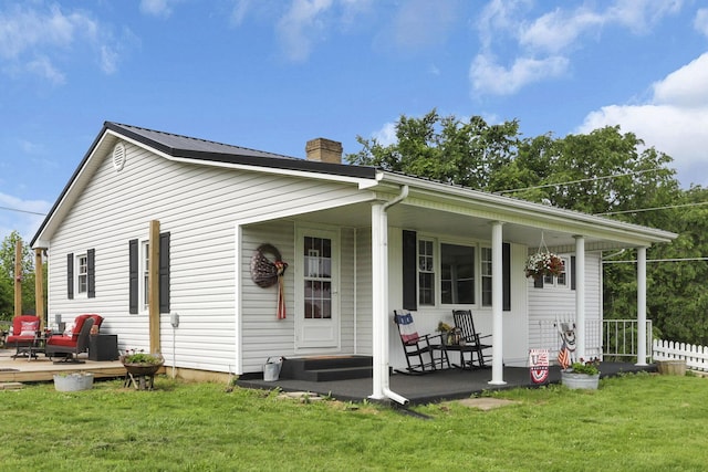 17519 Thompson Ridge Rd, Laurelville, OH 43135 - back of house with a porch and a chimney