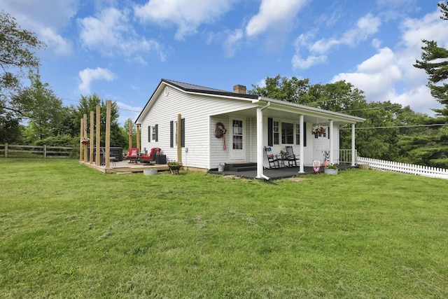 17519 Thompson Ridge Rd, Laurelville, OH 43135 - view of front of home featuring a fenced backyard, a chimney, a deck, and covered porch